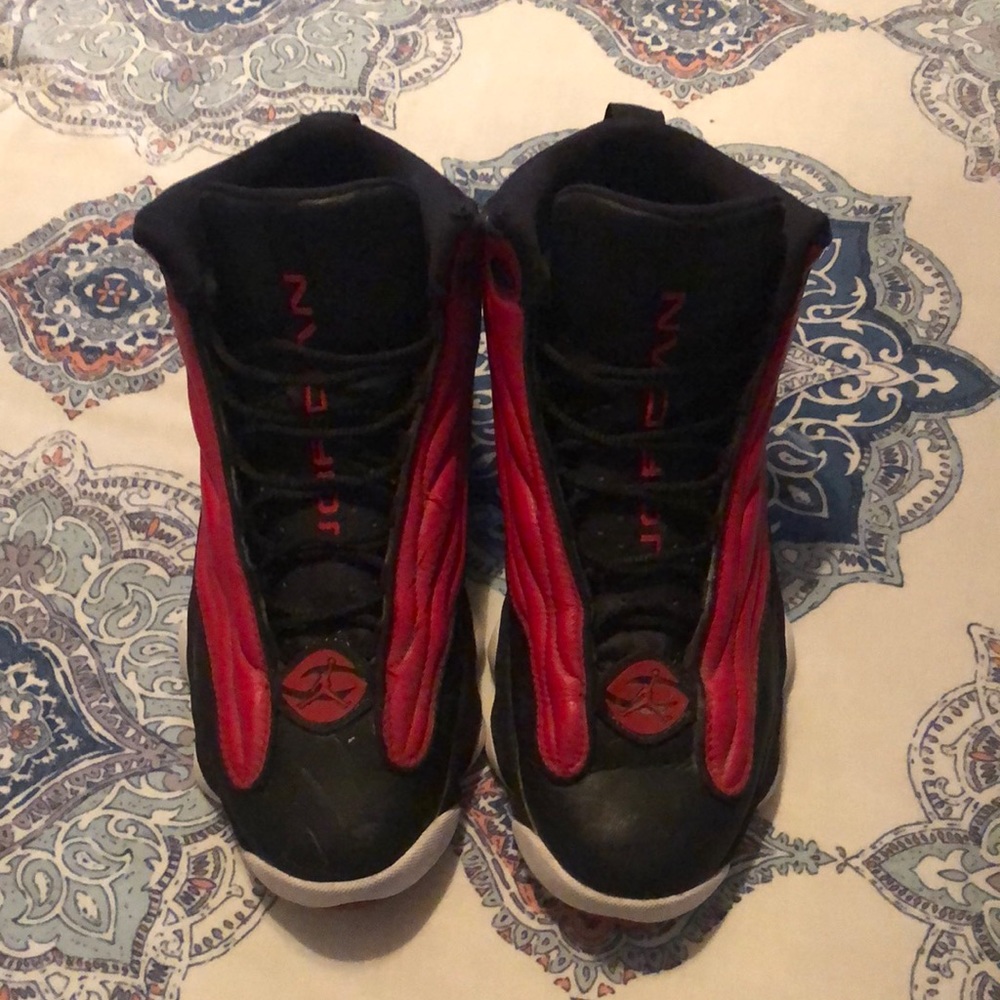 Men red and black Jordans